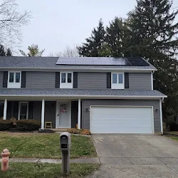 Rooftop solar install on a gray house